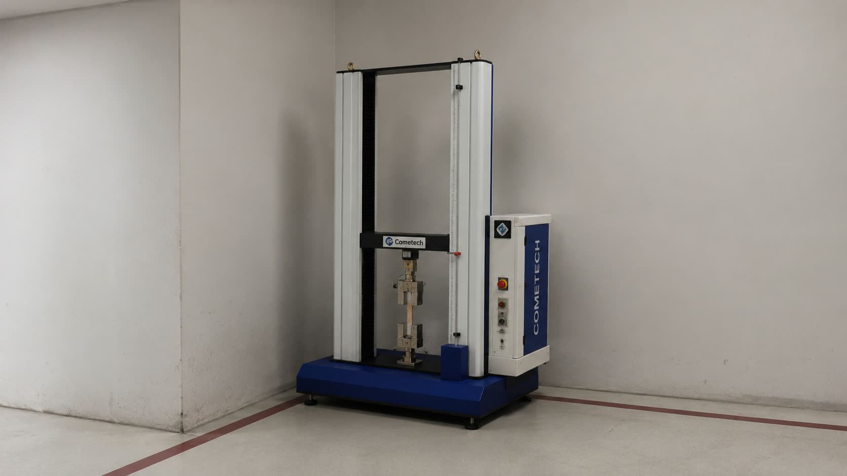 Compression testing machine in Metals of Bahrain's quality control lab
