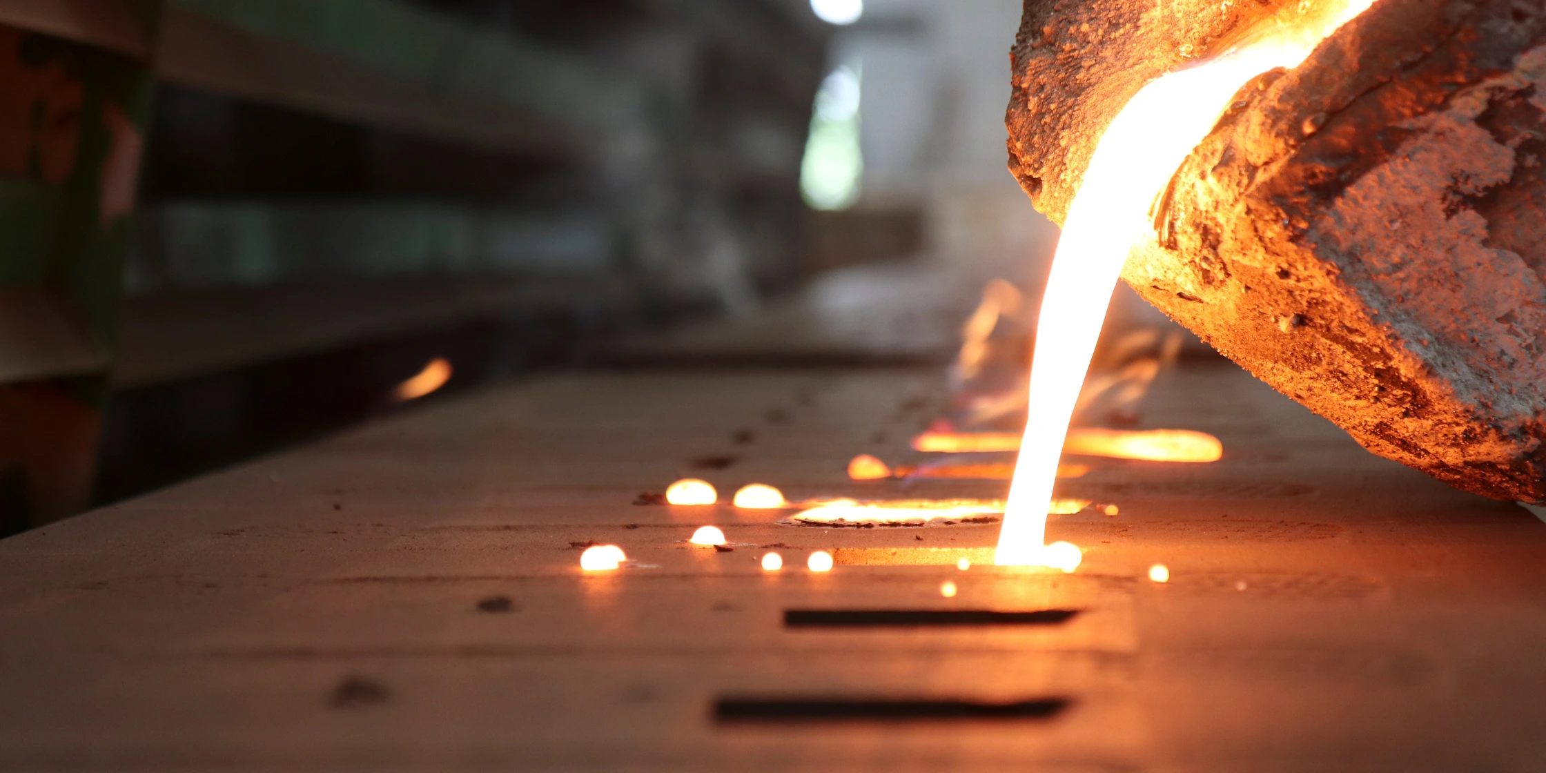 Molten metal poured into sand-cast moulds at the Metals of Bahrain foundry